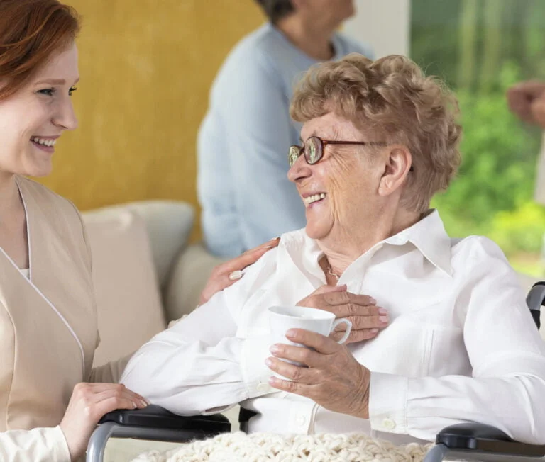 young caretaker making a geriatric pensioner in a 2023 11 27 05 10 35 utc scaled e1715849156195